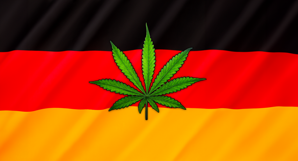 Deutsche Flagge mit einem Cannabisblatt verziert